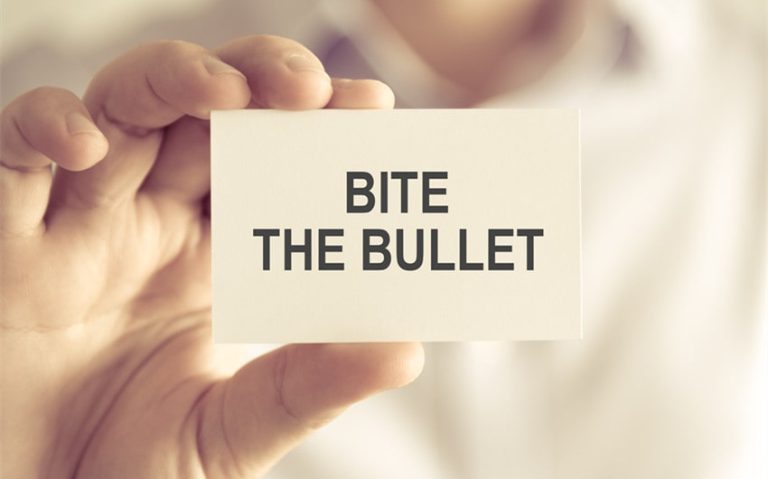 Bite the Bullet Meaning: Origins, Examples, and Related Idioms